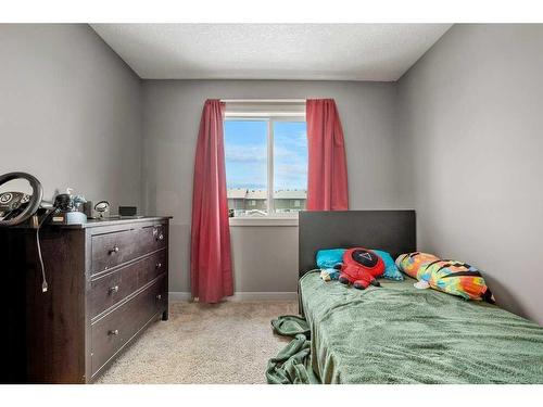 212 Silverado Range Close Sw, Calgary, AB - Indoor Photo Showing Bedroom