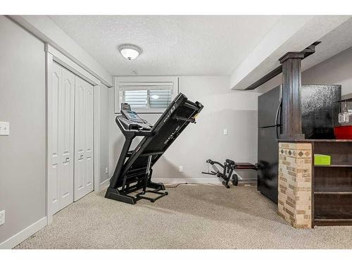 212 Silverado Range Close Sw, Calgary, AB - Indoor Photo Showing Gym Room