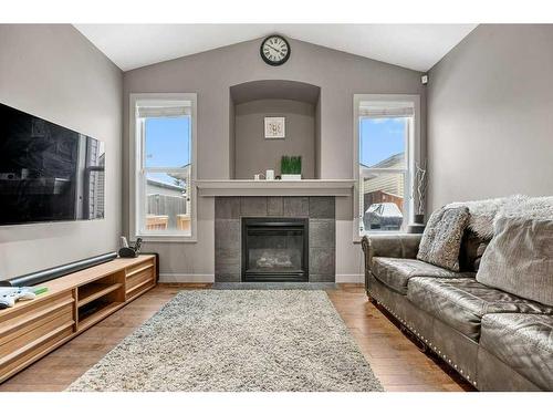 212 Silverado Range Close Sw, Calgary, AB - Indoor Photo Showing Living Room With Fireplace