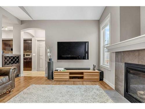 212 Silverado Range Close Sw, Calgary, AB - Indoor Photo Showing Living Room With Fireplace