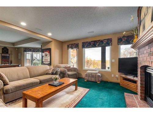 330 Diamond Drive Se, Calgary, AB - Indoor Photo Showing Living Room With Fireplace