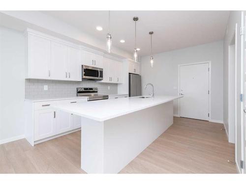 3410-220 Seton Grove Se, Calgary, AB - Indoor Photo Showing Kitchen With Upgraded Kitchen