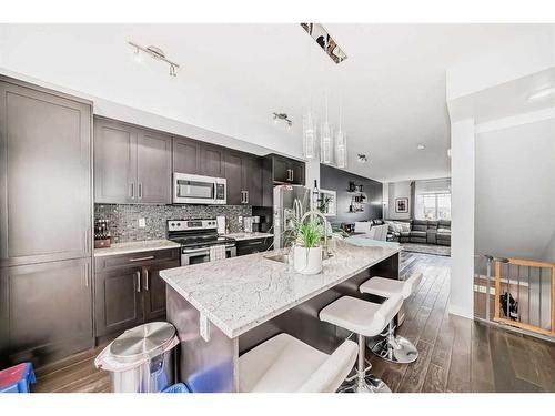 116-2802 Kings Heights Gate Se, Airdrie, AB - Indoor Photo Showing Kitchen With Upgraded Kitchen