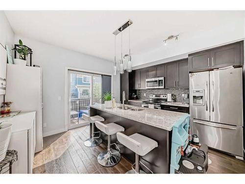 116-2802 Kings Heights Gate Se, Airdrie, AB - Indoor Photo Showing Kitchen With Upgraded Kitchen