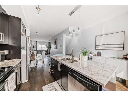 116-2802 Kings Heights Gate Se, Airdrie, AB - Indoor Photo Showing Kitchen With Upgraded Kitchen