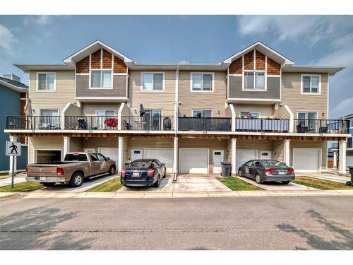 116-2802 Kings Heights Gate Se, Airdrie, AB - Outdoor With Balcony With Facade