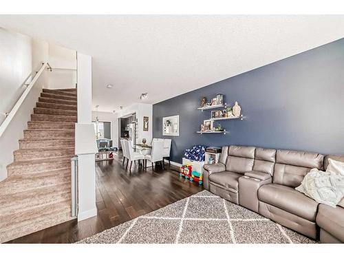 116-2802 Kings Heights Gate Se, Airdrie, AB - Indoor Photo Showing Living Room