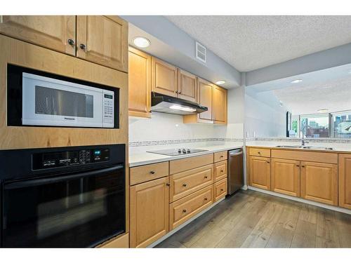 608-1100 8 Avenue Sw, Calgary, AB - Indoor Photo Showing Kitchen With Double Sink