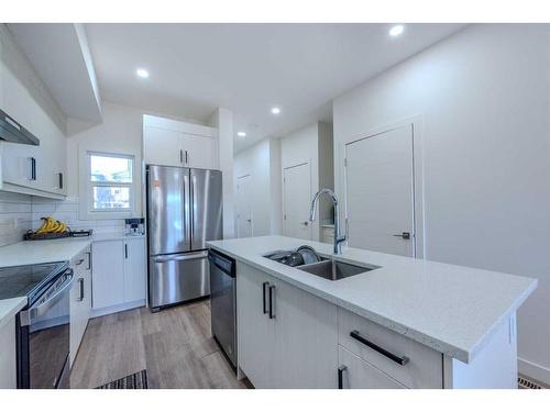 105-116 Saddlestone Heath Ne, Calgary, AB - Indoor Photo Showing Kitchen With Stainless Steel Kitchen With Double Sink With Upgraded Kitchen