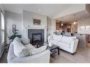 111 Legacy Glen Park Se, Calgary, AB  - Indoor Photo Showing Living Room With Fireplace 