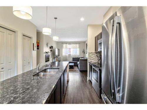 203 Copperpond Row Se, Calgary, AB - Indoor Photo Showing Kitchen With Double Sink With Upgraded Kitchen