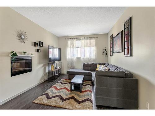 203 Copperpond Row Se, Calgary, AB - Indoor Photo Showing Living Room