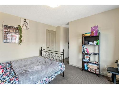 203 Copperpond Row Se, Calgary, AB - Indoor Photo Showing Bedroom