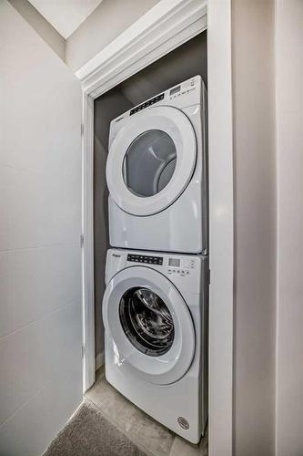 38 Evanscrest Court Nw, Calgary, AB - Indoor Photo Showing Laundry Room