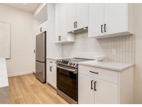 2024 22 Avenue Nw, Calgary, AB - Indoor Photo Showing Kitchen With Stainless Steel Kitchen