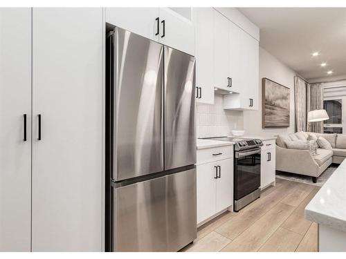 2024 22 Avenue Nw, Calgary, AB - Indoor Photo Showing Kitchen With Stainless Steel Kitchen