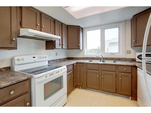 406-3727 42 Street Nw, Calgary, AB - Indoor Photo Showing Kitchen With Double Sink