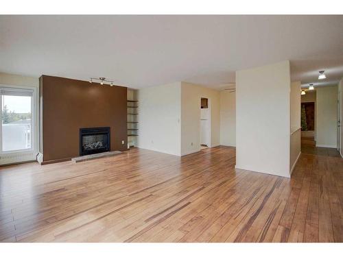 406-3727 42 Street Nw, Calgary, AB - Indoor Photo Showing Living Room With Fireplace