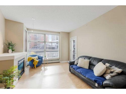 417-315 24 Avenue Sw, Calgary, AB - Indoor Photo Showing Living Room With Fireplace