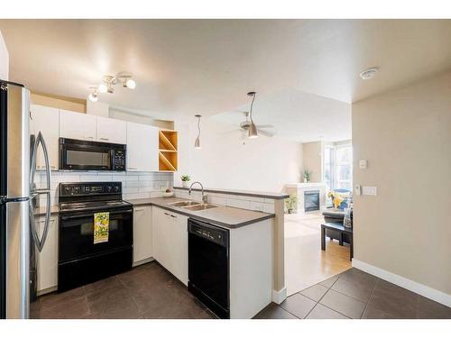 417-315 24 Avenue Sw, Calgary, AB - Indoor Photo Showing Kitchen With Double Sink