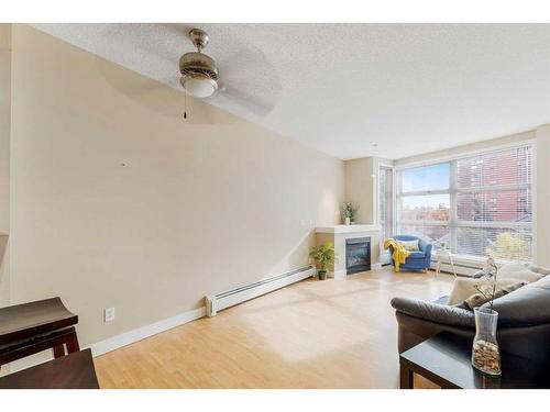 417-315 24 Avenue Sw, Calgary, AB - Indoor Photo Showing Living Room With Fireplace