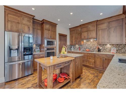 18 Silverado Ranch Way Sw, Calgary, AB - Indoor Photo Showing Kitchen With Double Sink With Upgraded Kitchen