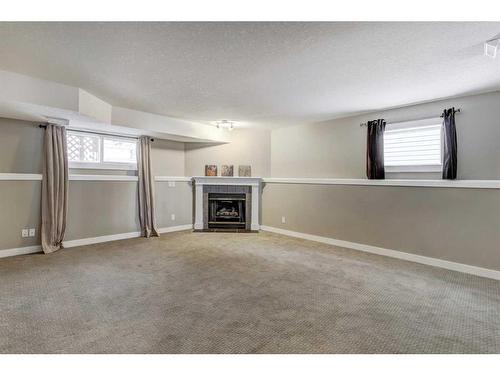 61 Coventry Close Ne, Calgary, AB - Indoor With Fireplace