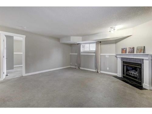 61 Coventry Close Ne, Calgary, AB - Indoor With Fireplace