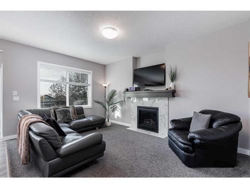 244 Nolanfield Way Nw, Calgary, AB - Indoor Photo Showing Living Room With Fireplace