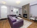 344 Quarry Park Boulevard Se, Calgary, AB  - Indoor Photo Showing Living Room With Fireplace 