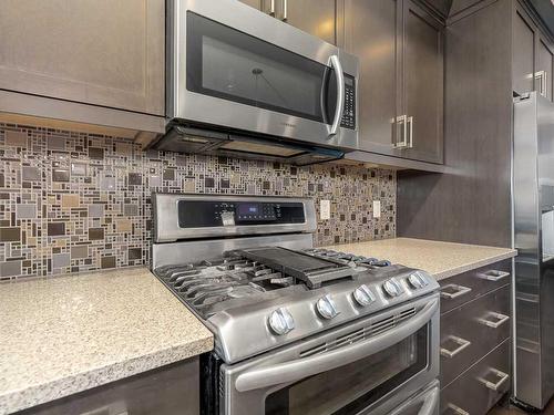 344 Quarry Park Boulevard Se, Calgary, AB - Indoor Photo Showing Kitchen With Stainless Steel Kitchen