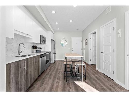 224-1605 17 Street Se, Calgary, AB - Indoor Photo Showing Kitchen With Double Sink