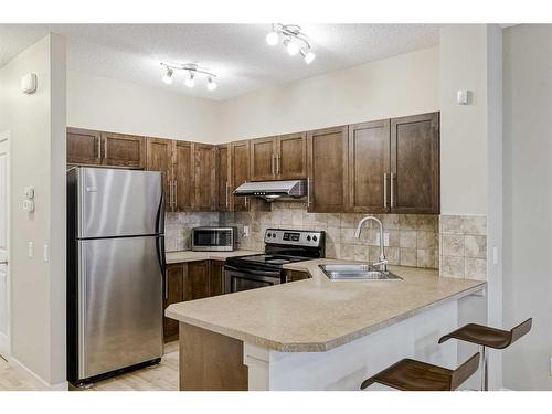 1212-155 Silverado Skies Link Sw, Calgary, AB - Indoor Photo Showing Kitchen With Double Sink