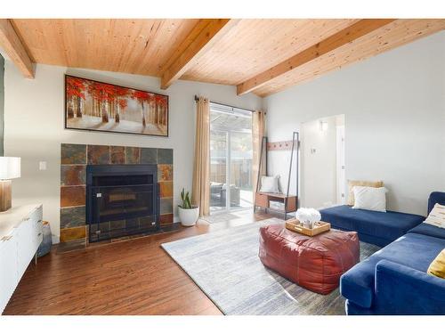 2623 Glenmount Drive Sw, Calgary, AB - Indoor Photo Showing Living Room With Fireplace