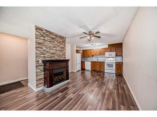 30-75 Templemont Way Ne, Calgary, AB - Indoor With Fireplace