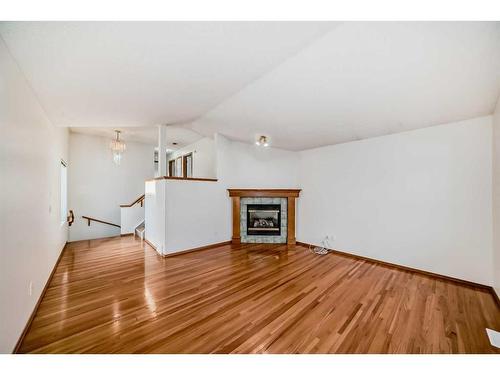 132 San Fernando Crescent Ne, Calgary, AB - Indoor Photo Showing Living Room With Fireplace