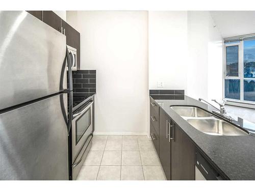 1102-325 3 Street Se, Calgary, AB - Indoor Photo Showing Kitchen With Stainless Steel Kitchen With Double Sink