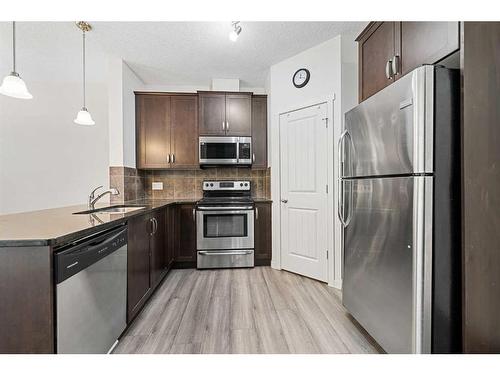 229 Copperpond Landing Se, Calgary, AB - Indoor Photo Showing Kitchen With Stainless Steel Kitchen With Upgraded Kitchen