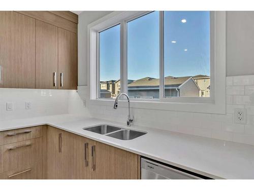 421 Chelsea Key, Chestermere, AB - Indoor Photo Showing Kitchen With Double Sink