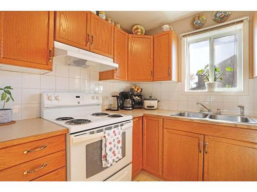 319 16 Street East, Brooks, AB - Indoor Photo Showing Kitchen With Double Sink