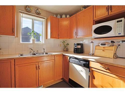 319 16 Street East, Brooks, AB - Indoor Photo Showing Kitchen With Double Sink