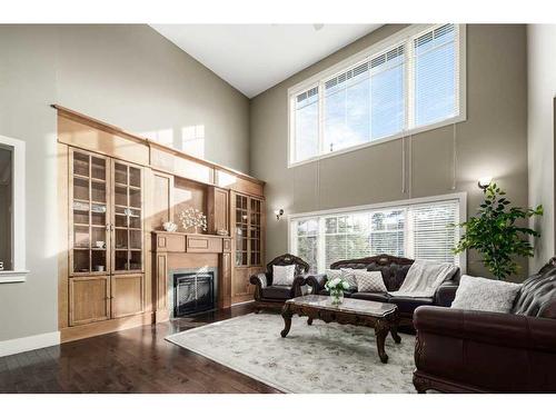 19 Aspen Meadows Manor Sw, Calgary, AB - Indoor Photo Showing Living Room With Fireplace