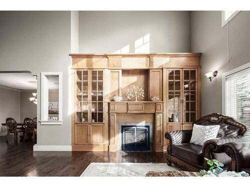 19 Aspen Meadows Manor Sw, Calgary, AB - Indoor Photo Showing Living Room With Fireplace