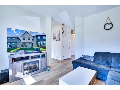 516 South Point Place Sw, Airdrie, AB - Indoor Photo Showing Living Room With Fireplace