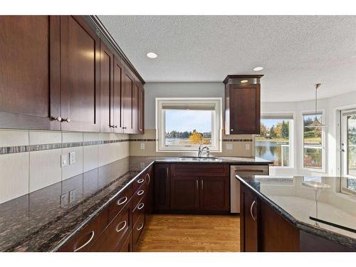 15 Suncastle Place Se, Calgary, AB - Indoor Photo Showing Kitchen With Double Sink