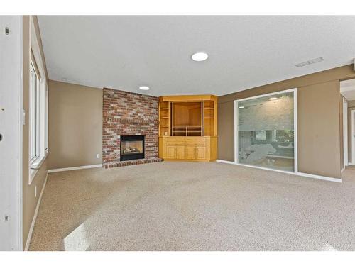 15 Suncastle Place Se, Calgary, AB - Indoor With Fireplace