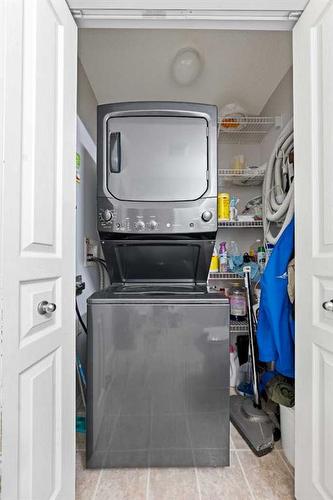 28 Bridleridge Gardens Sw, Calgary, AB - Indoor Photo Showing Laundry Room