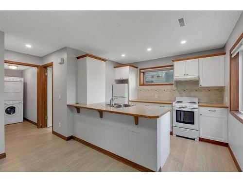 176 Panorama Hills Place Nw, Calgary, AB - Indoor Photo Showing Kitchen With Double Sink