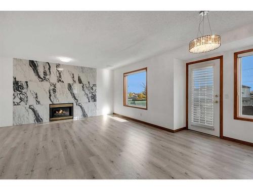 176 Panorama Hills Place Nw, Calgary, AB - Indoor Photo Showing Living Room With Fireplace