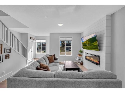 139 Howse Crescent Ne, Calgary, AB - Indoor Photo Showing Living Room With Fireplace